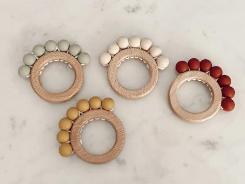 Imagen oficial de Various rattles and teething rings publicada por OECD 3