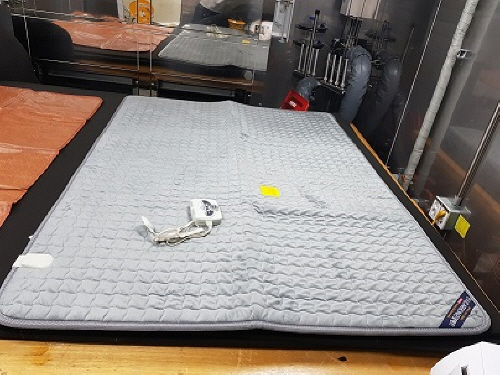 Official image of Electric heated mat published by OECD