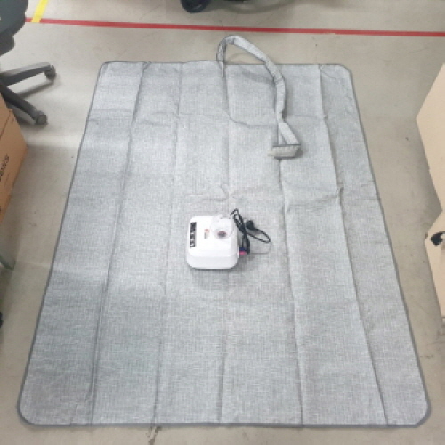 Official image of Electric-heated hot water mat published by OECD